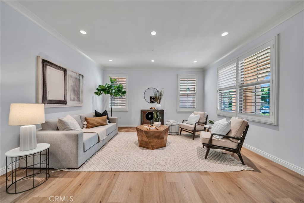 113 Mayfair Irvine, CA 92620 - Photo 5 of 31 a living room with furniture and wooden floor