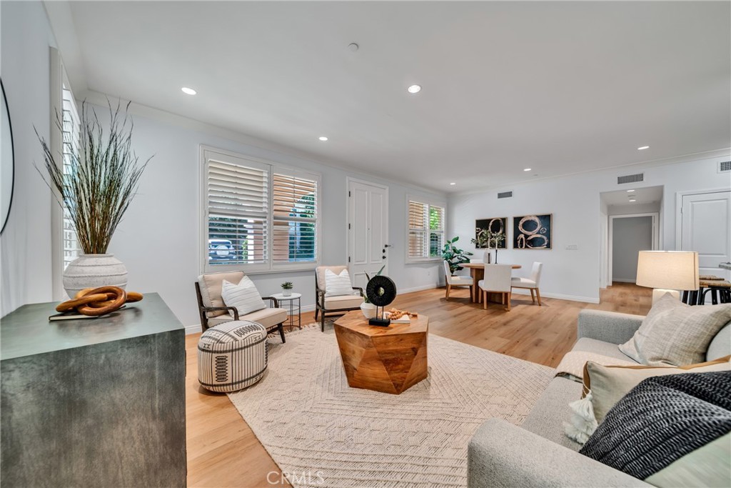 113 Mayfair Irvine, CA 92620 - Photo 7 of 31 a living room with furniture and a large window