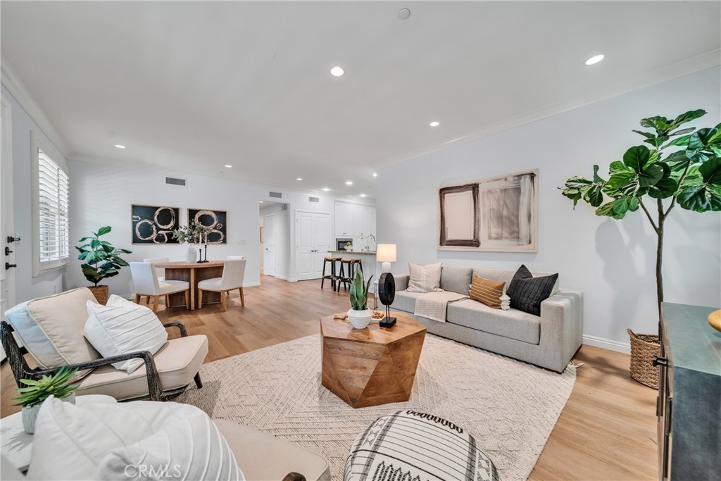 113 Mayfair Irvine, CA 92620 - Photo 8 of 31 a living room with furniture potted plant and a table