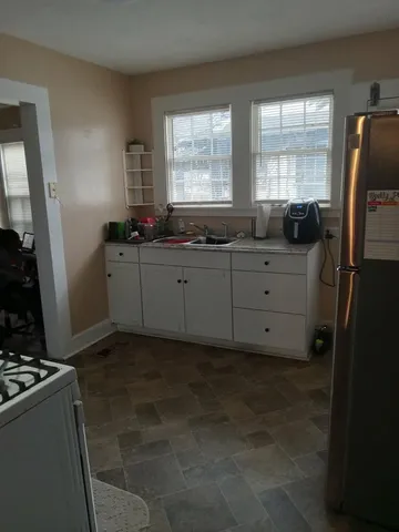 a room with mirror and window