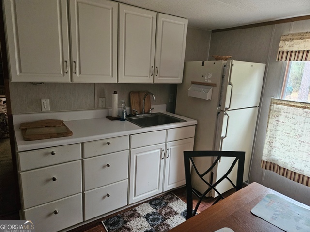 1377 Hillside Drive Claxton, GA 30417 - Photo 14 of 24 a kitchen with appliances a sink and cabinets