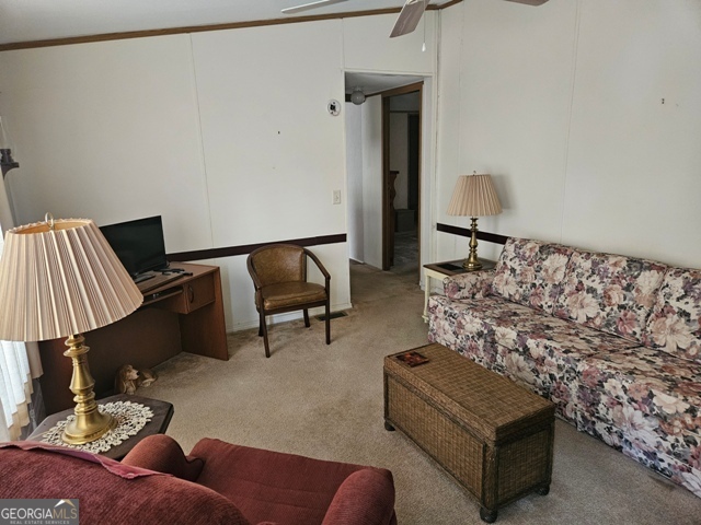 1377 Hillside Drive Claxton, GA 30417 - Photo 15 of 24 a living room with furniture and a lamp