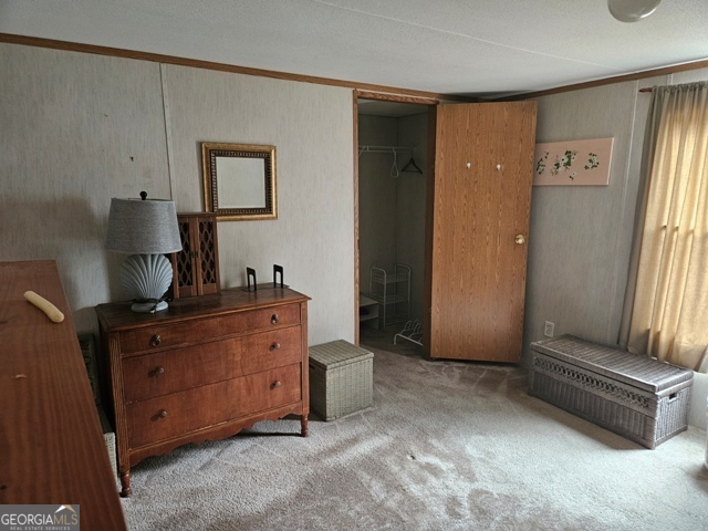 1377 Hillside Drive Claxton, GA 30417 - Photo 19 of 24 a room with a dresser and a mirror