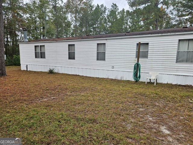 1377 Hillside Drive Claxton, GA 30417 - Photo 2 of 24 a view of a backyard with a garden