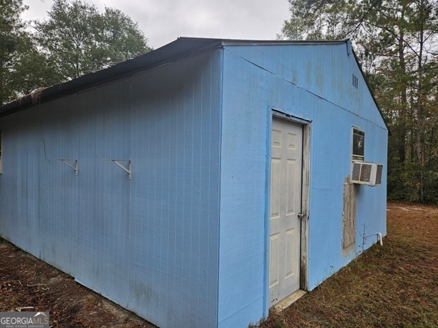 1377 Hillside Drive Claxton, GA 30417 - Photo 23 of 24 a view of a house with a backyard