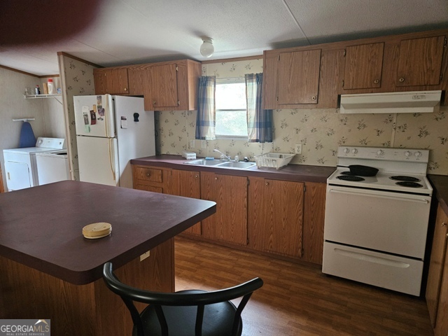1377 Hillside Drive Claxton, GA 30417 - Photo 3 of 24 a kitchen with stainless steel appliances granite countertop a sink a stove a refrigerator and a refrigerator