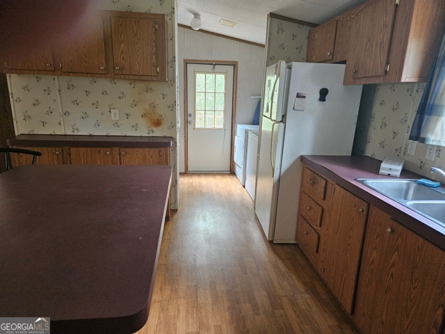 1377 Hillside Drive Claxton, GA 30417 - Photo 4 of 24 a view of a kitchen from the hallway