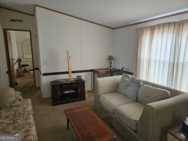 1377 Hillside Drive Claxton, GA 30417 - Photo 7 of 24 a living room with furniture and wooden floor