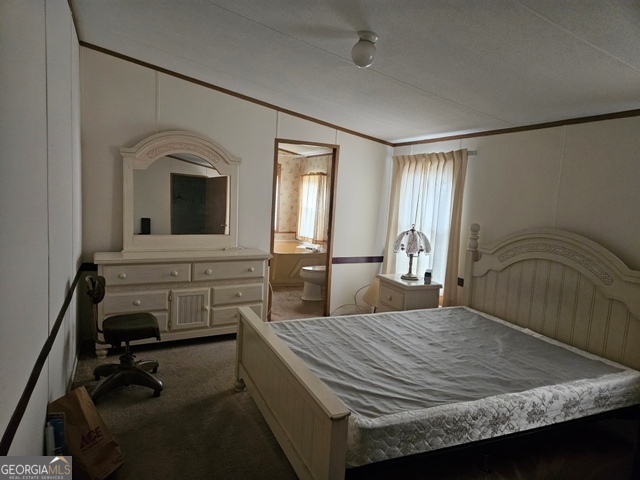 1377 Hillside Drive Claxton, GA 30417 - Photo 9 of 24 a bedroom with a bed and a view of bathroom