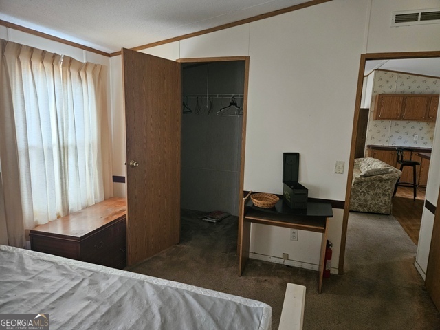 1377 Hillside Drive Claxton, GA 30417 - Photo 10 of 24 a bedroom with a bed and a window