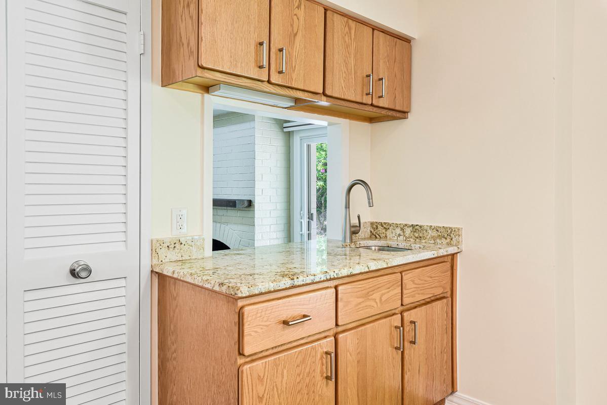 11814 Blue Spruce Road Reston, VA 20191 - Photo 13 of 56 a kitchen with stainless steel appliances granite countertop a sink and cabinets