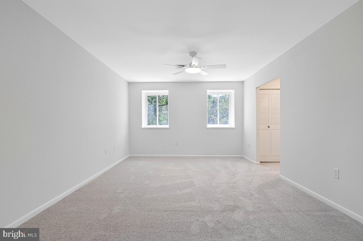 11814 Blue Spruce Road Reston, VA 20191 - Photo 23 of 56 an empty room with windows and closet
