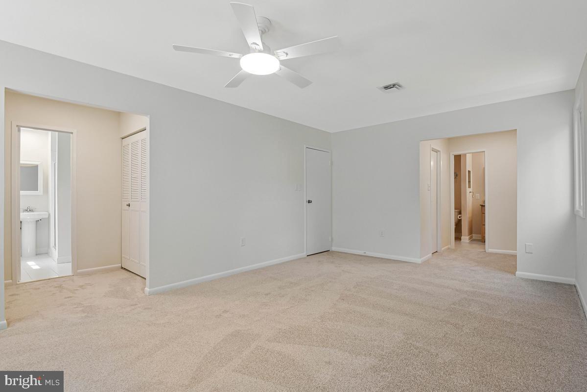 11814 Blue Spruce Road Reston, VA 20191 - Photo 24 of 56 a view of an empty room with a ceiling fan