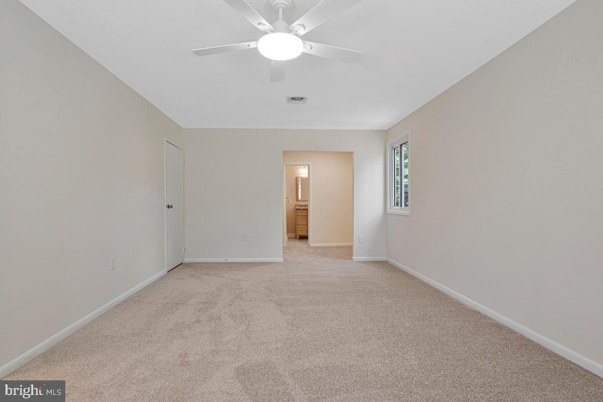 11814 Blue Spruce Road Reston, VA 20191 - Photo 25 of 56 a view of an empty room with a window
