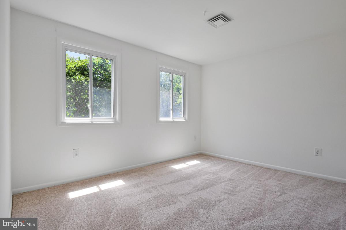 11814 Blue Spruce Road Reston, VA 20191 - Photo 31 of 56 an empty room with windows