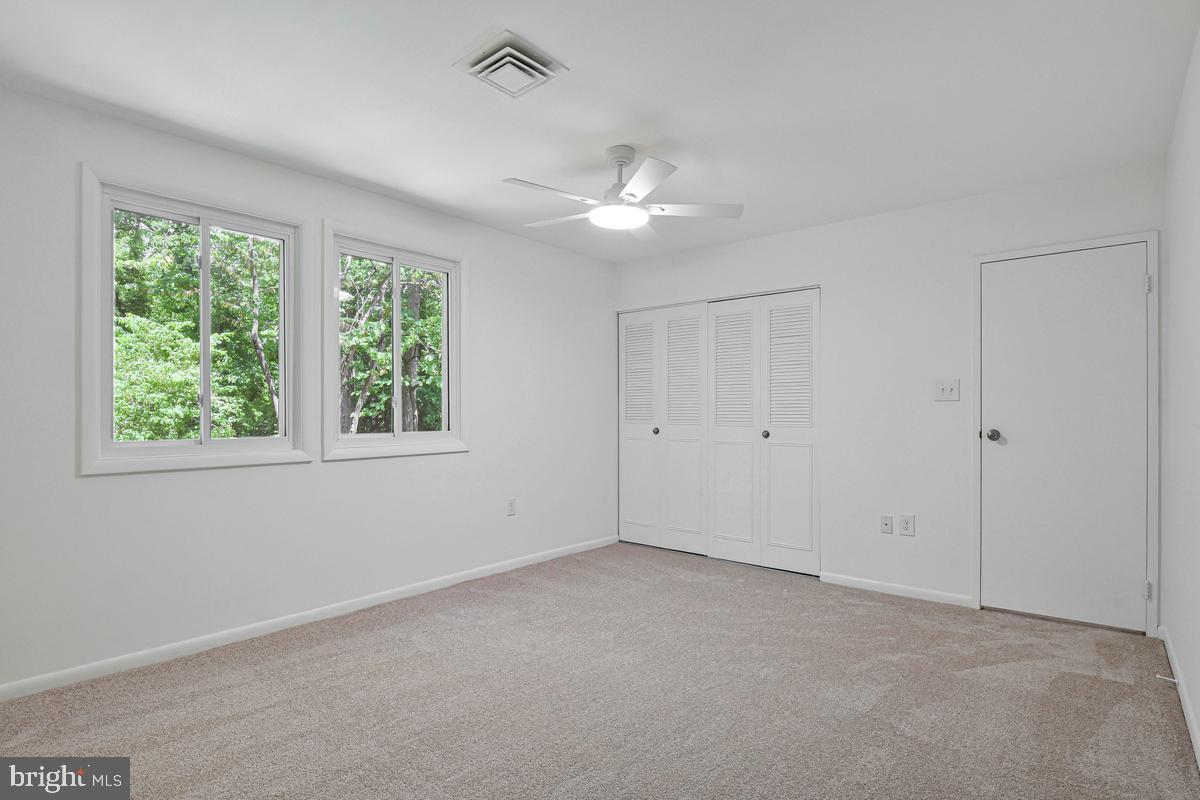 11814 Blue Spruce Road Reston, VA 20191 - Photo 34 of 56 a view of an empty room with a window