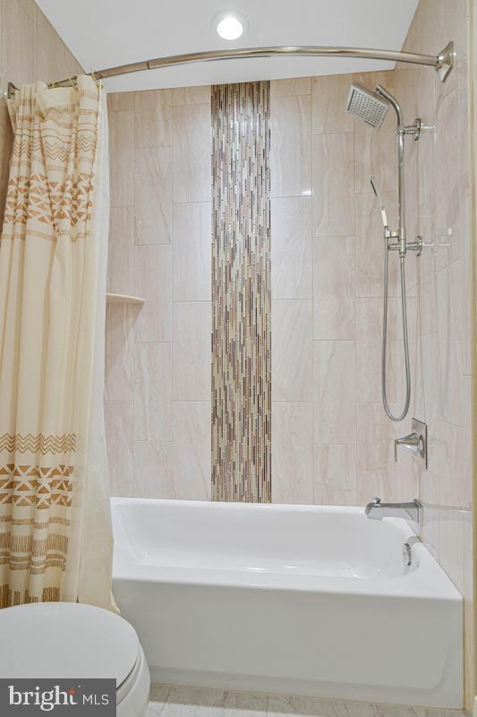 11814 Blue Spruce Road Reston, VA 20191 - Photo 39 of 56 a bathroom with a shower and a sink