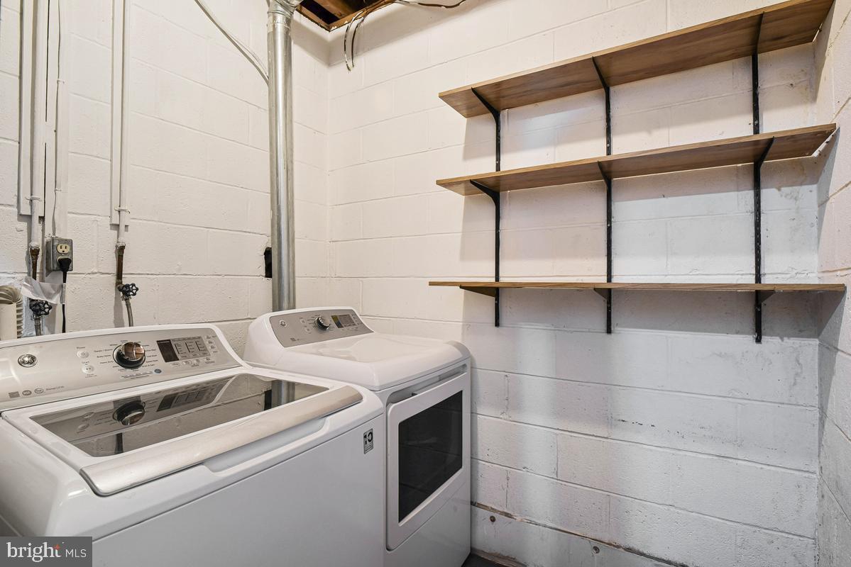 11814 Blue Spruce Road Reston, VA 20191 - Photo 45 of 56 a utility room with dryer and washer
