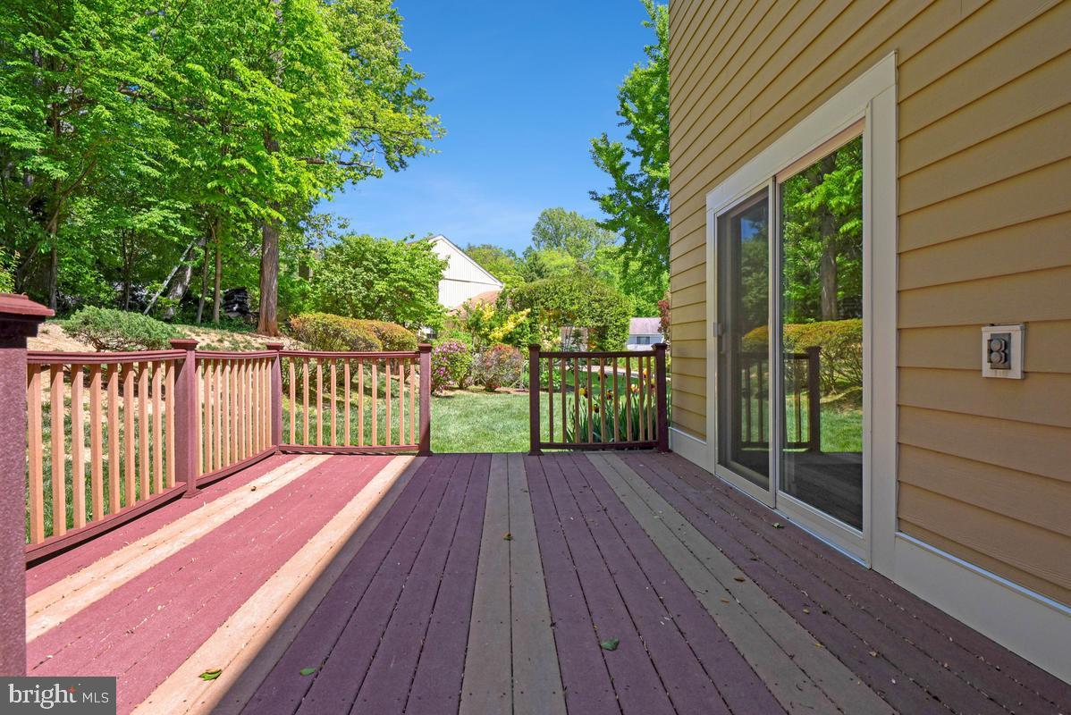 11814 Blue Spruce Road Reston, VA 20191 - Photo 47 of 56 a view of backyard with a deck and wooden floor