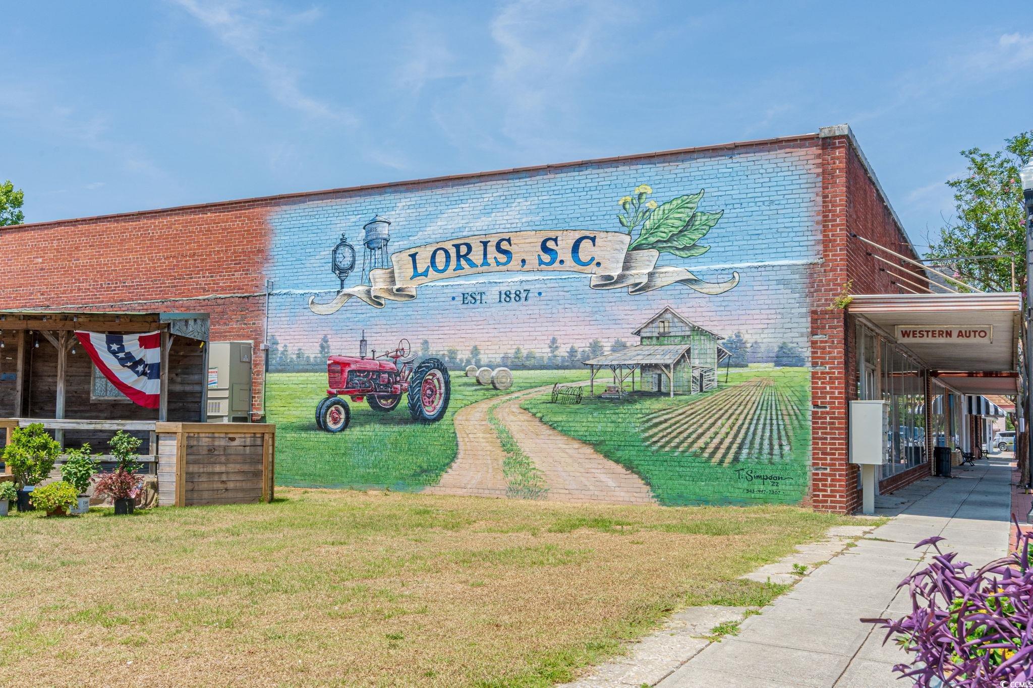 1996 Heritage Road Loris, SC 29569 - Photo 40 of 40 Community / neighborhood sign with a lawn