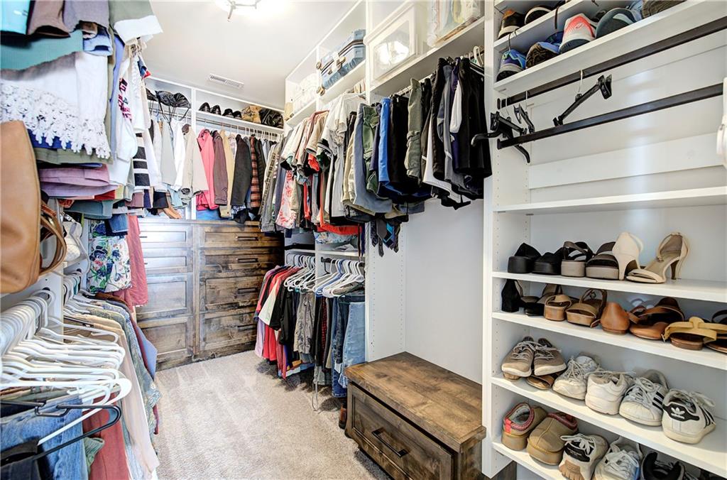 402 Perth Drive Cartersville, GA 30121 - Photo 16 of 31 a view of walk in closet with clothes and shoes