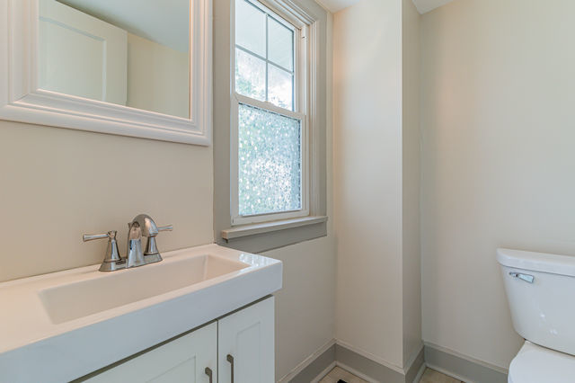 1616 West Church Street Champaign, IL 61821 - Photo 15 of 32 a bathroom with a sink and a toilet