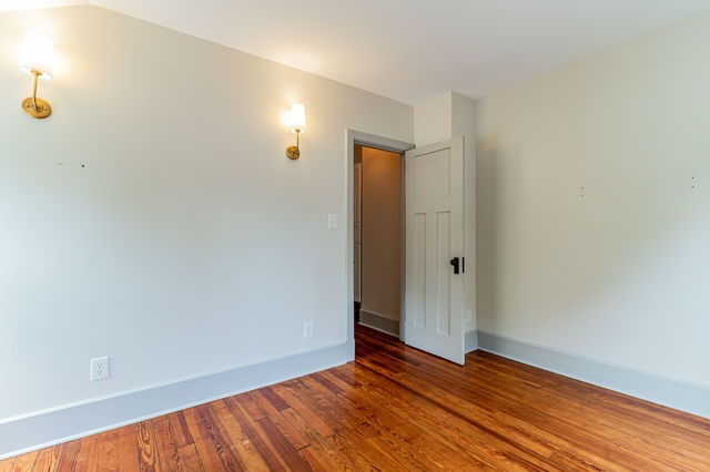 1616 West Church Street Champaign, IL 61821 - Photo 21 of 32 a view of an empty room with wooden floor