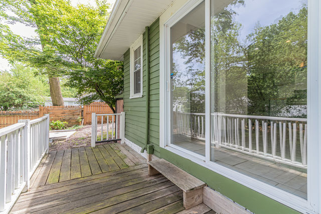 1616 West Church Street Champaign, IL 61821 - Photo 27 of 32 a view of balcony with wooden floor and outdoor space