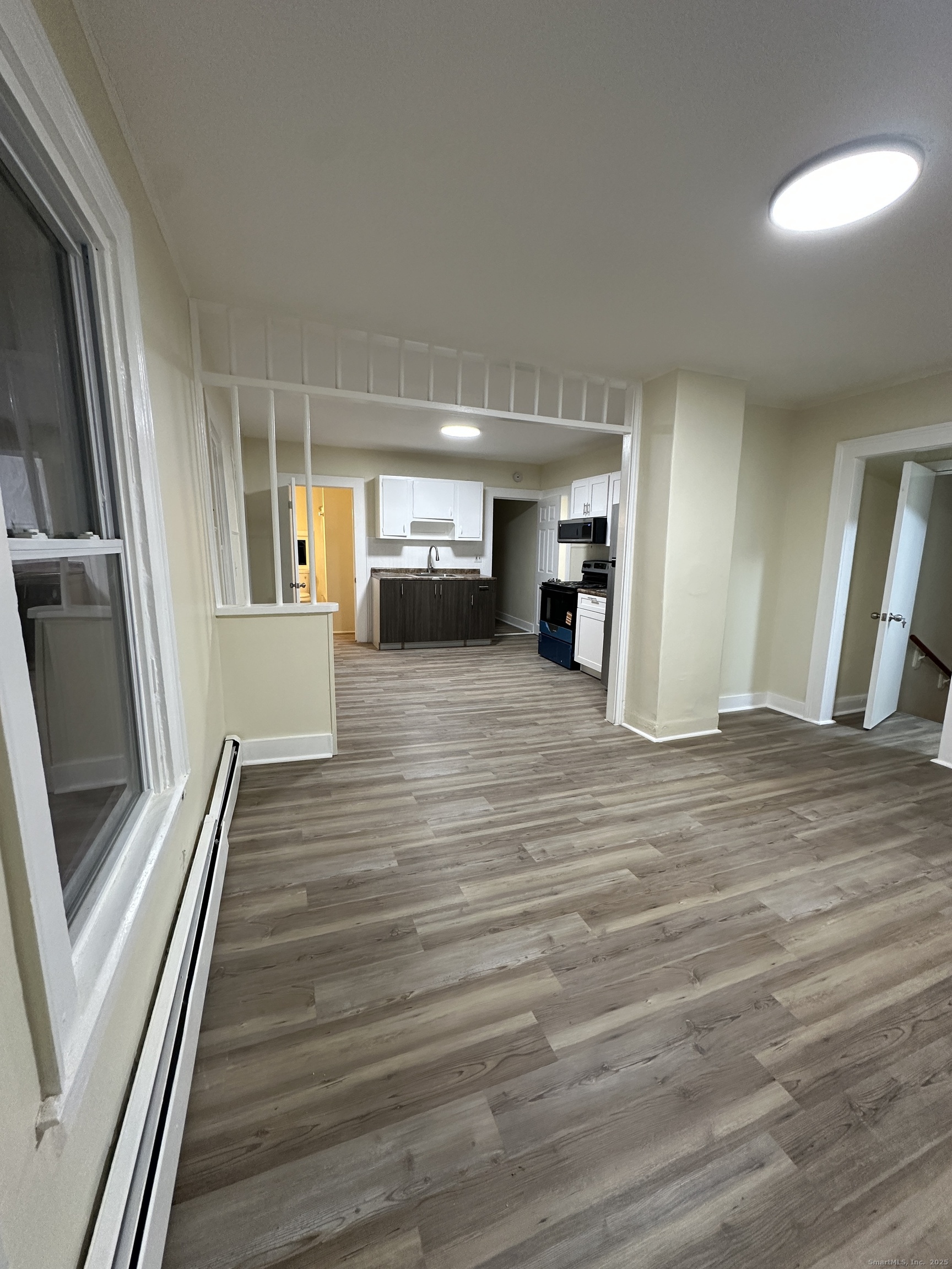 42 Spring Street New London, CT 06320 - Photo 9 of 10 a view of a hallway view with wooden floor and staircase