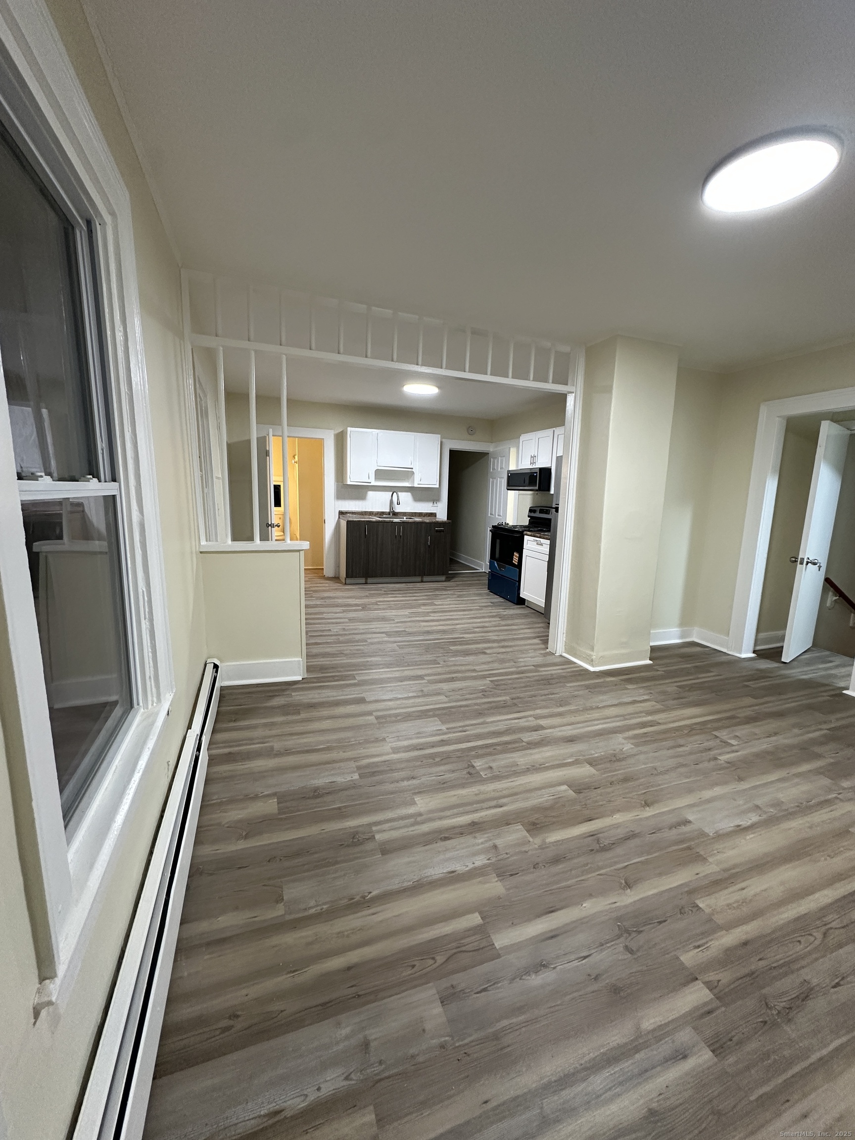 42 Spring Street New London, CT 06320 - Photo 10 of 10 a view of a hallway view with wooden floor and staircase