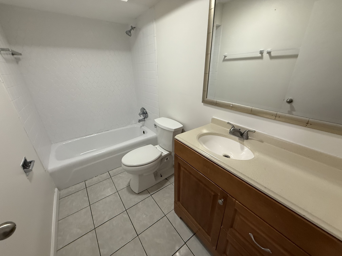 2300 North Harlem Avenue, Unit 205 Elmwood Park, IL 60707 - Photo 11 of 12 a bathroom with a sink a toilet and shower