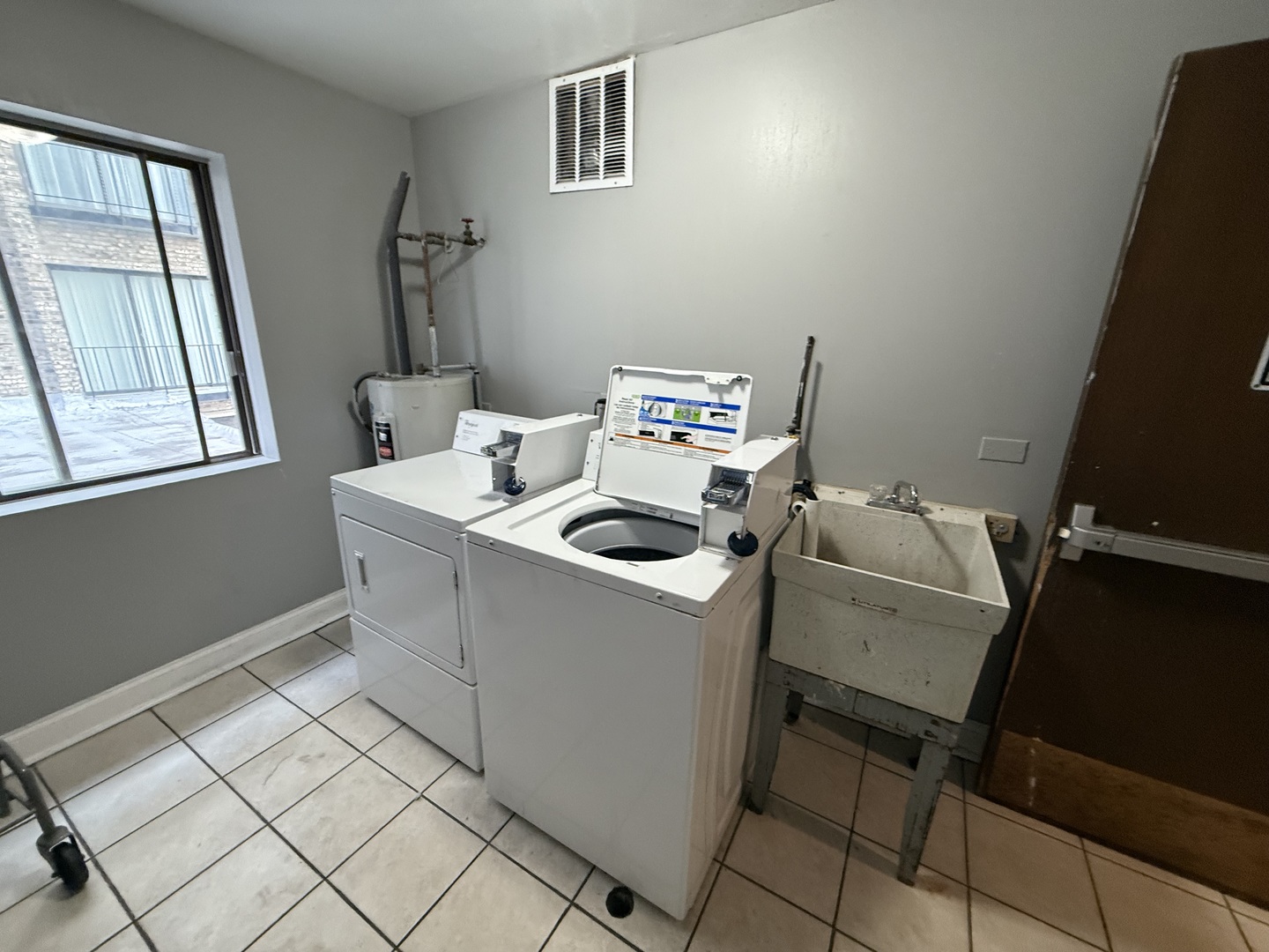 2300 North Harlem Avenue, Unit 205 Elmwood Park, IL 60707 - Photo 12 of 12 a utility room with dryer and washer
