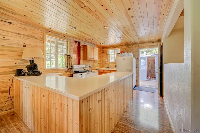 a front view of a house with outdoor seating