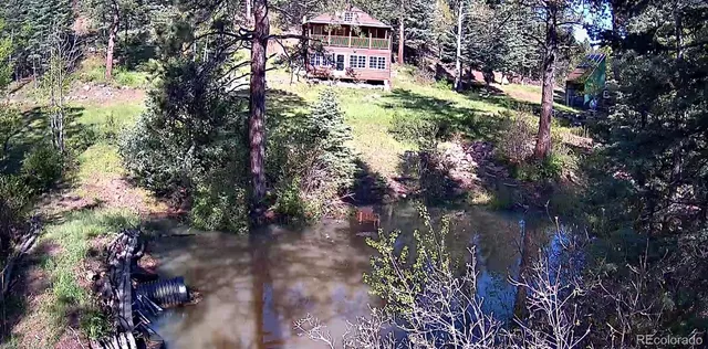 a view of a lake with mountain