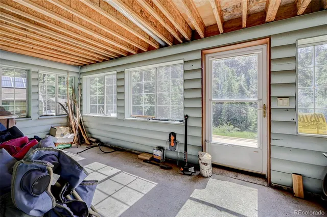 a room with gym equipment and a large window
