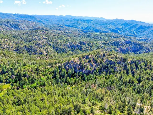 a view of a house with a yard porch and sitting area