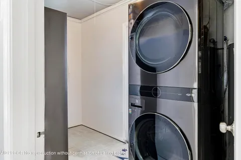 a close view of a utility room with dryer and washer