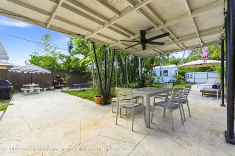 a view of a chairs and table in a patio