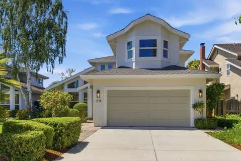 a front view of a house with garage