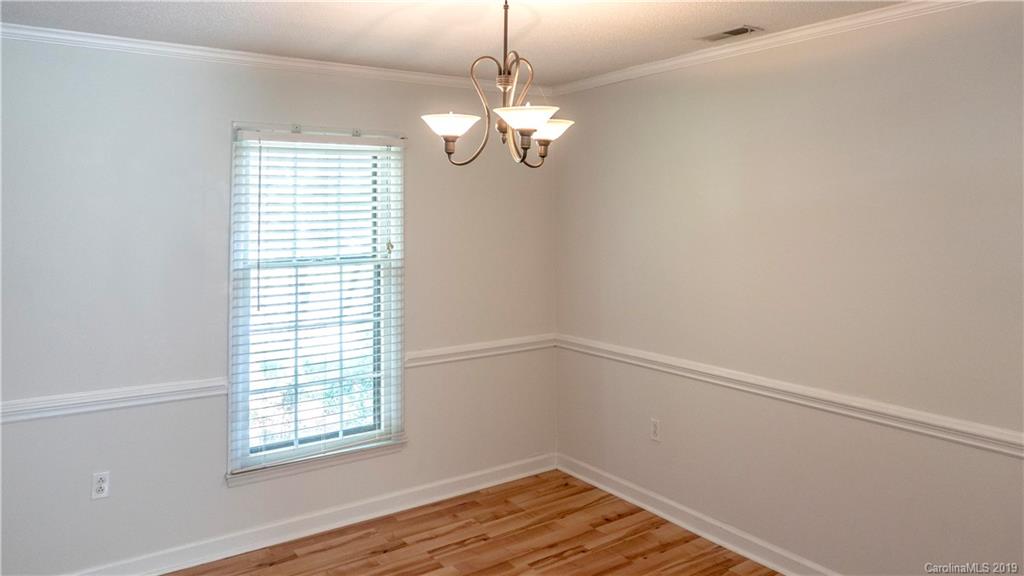 1708 Lawton Bluff Road Charlotte, NC 28226 - Photo 15 of 25 a view of a room with wooden floor and windows