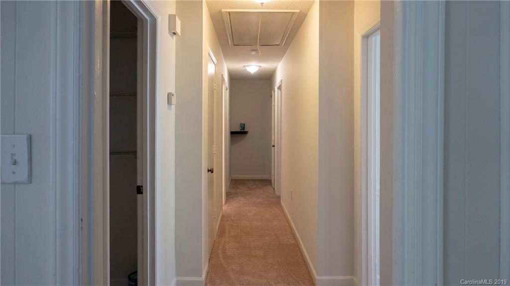 1708 Lawton Bluff Road Charlotte, NC 28226 - Photo 17 of 25 a view of a hallway with wooden floor