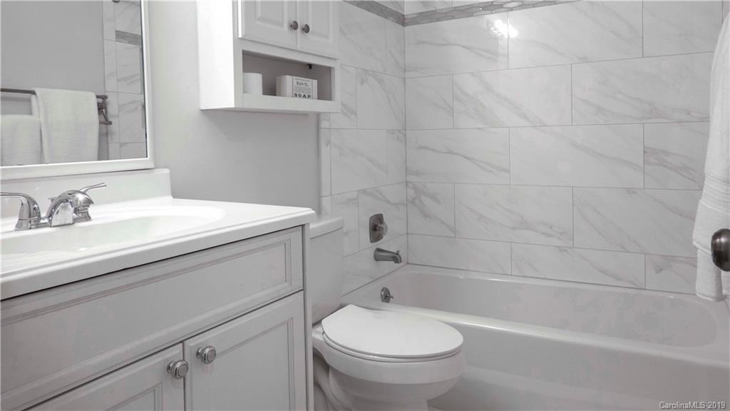 1708 Lawton Bluff Road Charlotte, NC 28226 - Photo 19 of 25 a bathroom with a sink toilet and shower
