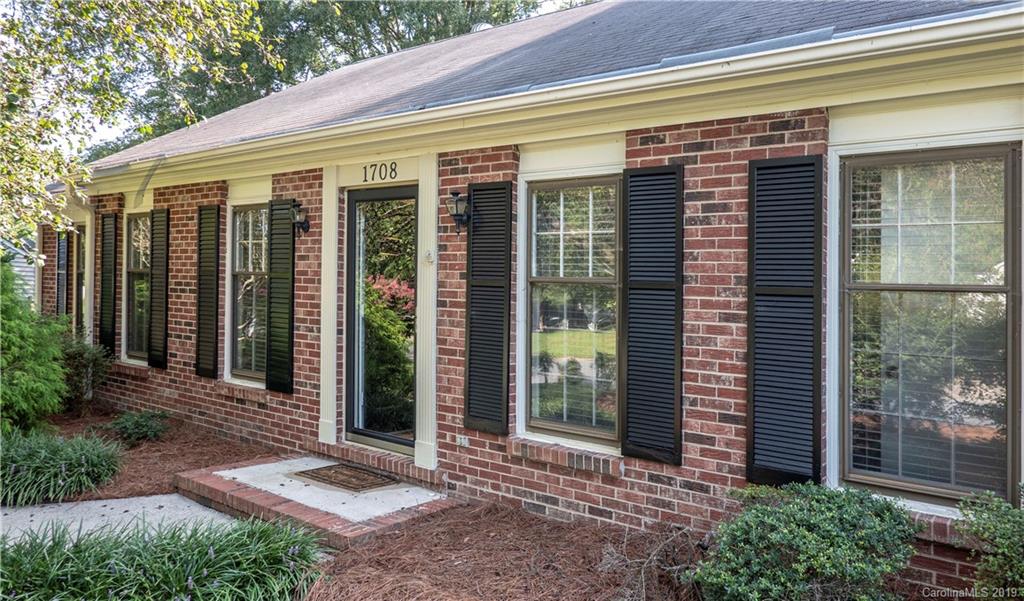 1708 Lawton Bluff Road Charlotte, NC 28226 - Photo 3 of 25 a front view of a house with a garden
