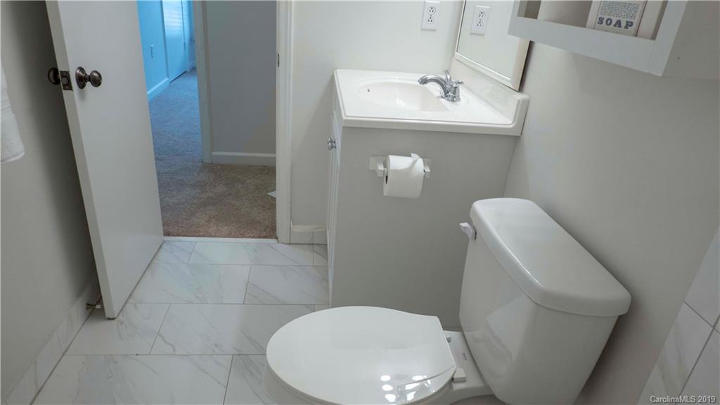 1708 Lawton Bluff Road Charlotte, NC 28226 - Photo 21 of 25 a bathroom with a sink toilet and shower