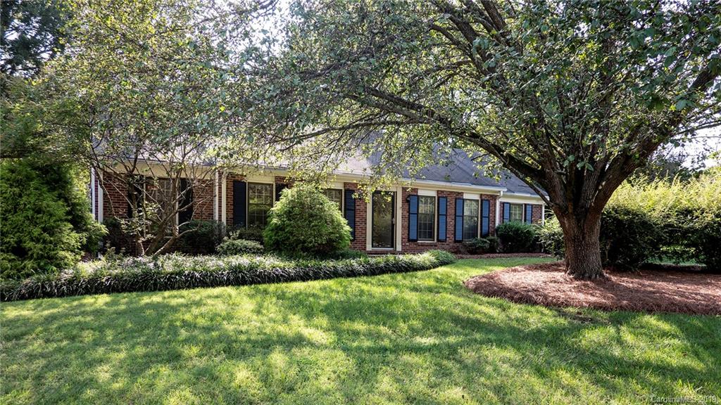 1708 Lawton Bluff Road Charlotte, NC 28226 - Photo 4 of 25 a front view of a house with a yard and trees