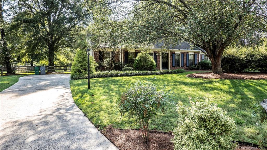 1708 Lawton Bluff Road Charlotte, NC 28226 - Photo 5 of 25 a front view of a house with a yard and trees