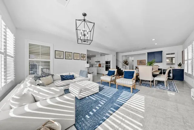 a living room with furniture and white walls