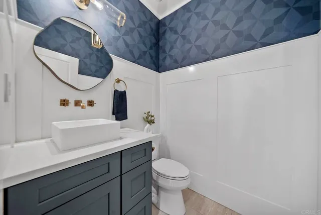 a bathroom with a double vanity sink and mirror