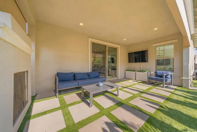 a bedroom with furniture and a rug
