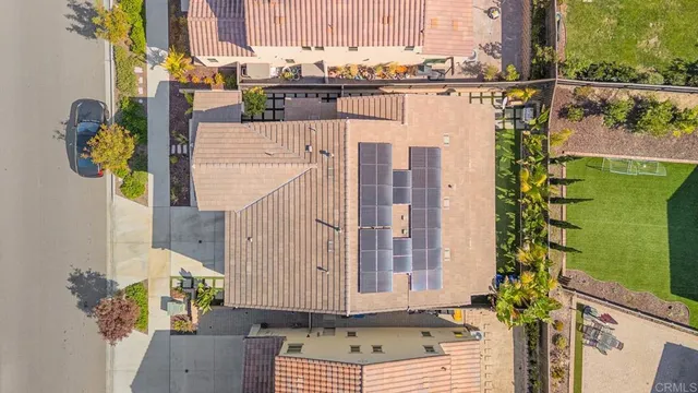 an aerial view of residential houses with outdoor space